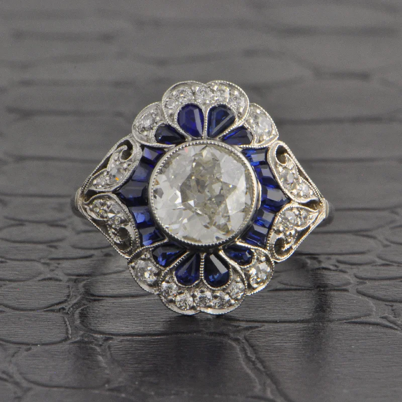 Trendy And Classic Jewelry Now At Reduced Prices Resplendent Art Deco Old European Cut Diamond and Sapphire Ring in Platinum
